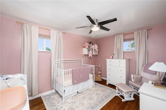 1072 N Ave, Baden, PA 15005 - bedroom featuring multiple windows, wood finished floors, a nursery area, and ceiling fan