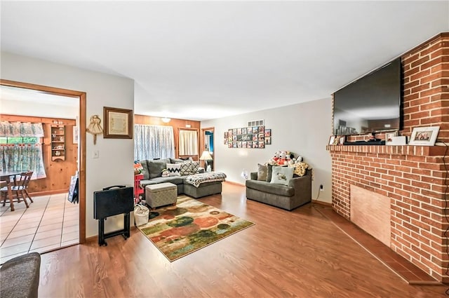 570 S 7th St, Sharpsville, PA 16150 - living room with a brick fireplace and wood finished floors