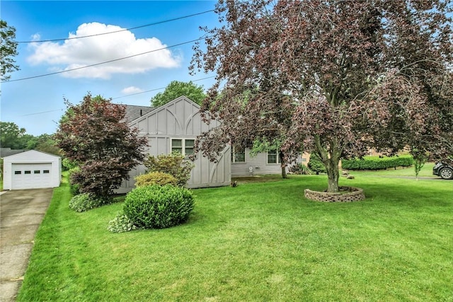 570 S 7th St, Sharpsville, PA 16150 - view of green lawn with driveway, an outdoor structure, and a garage