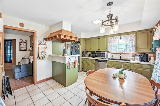 570 S 7th St, Sharpsville, PA 16150 - kitchen with green cabinets, appliances with stainless steel finishes, a chandelier, and light countertops