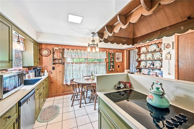 570 S 7th St, Sharpsville, PA 16150 - kitchen with green cabinets, stainless steel appliances, light countertops, and light tile patterned flooring