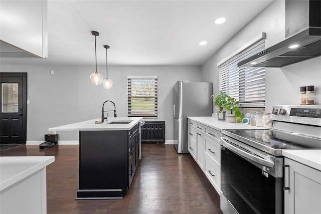 171 Clearview Ave, Ross Twp, PA 15229 - kitchen with appliances with stainless steel finishes, wall chimney exhaust hood, light countertops, a center island with sink, and white cabinets