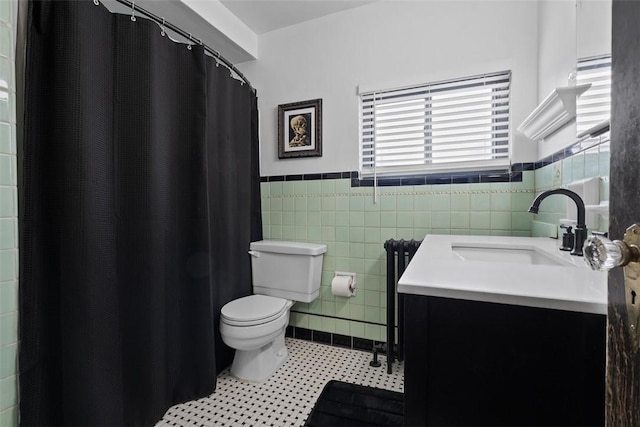 171 Clearview Ave, Ross Twp, PA 15229 - full bath with vanity, wainscoting, tile walls, radiator heating unit, and curtained shower