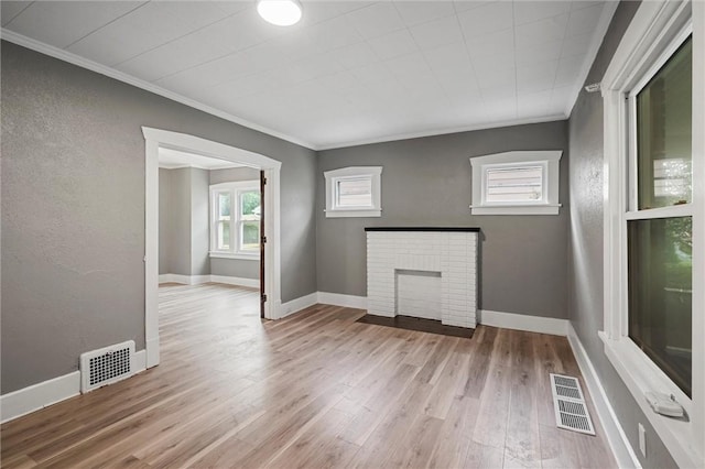 1204 Griswold St, Sharon, PA 16146 - unfurnished living room featuring ornamental molding, wood finished floors, and a fireplace