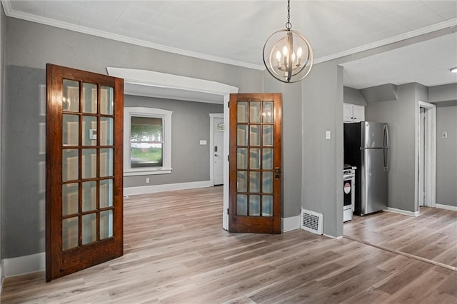 1204 Griswold St, Sharon, PA 16146 - unfurnished dining area with ornamental molding, light wood-type flooring, a chandelier, and french doors