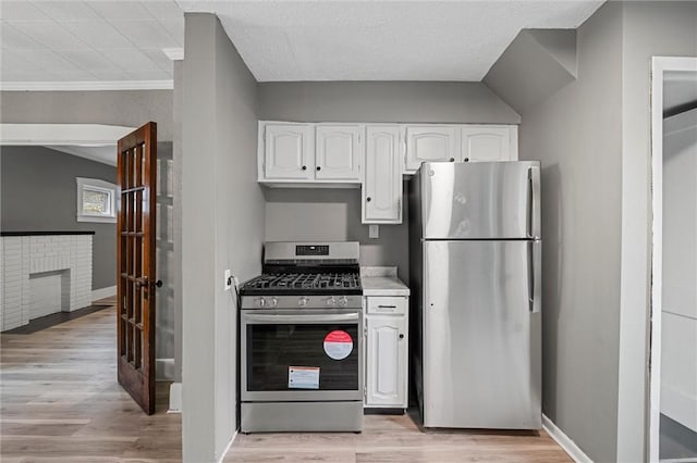 1204 Griswold St, Sharon, PA 16146 - kitchen featuring stainless steel appliances, white cabinets, light wood-type flooring, and light countertops