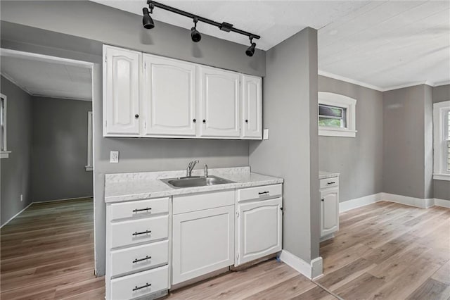 1204 Griswold St, Sharon, PA 16146 - kitchen with white cabinetry, light countertops, crown molding, and light wood-type flooring