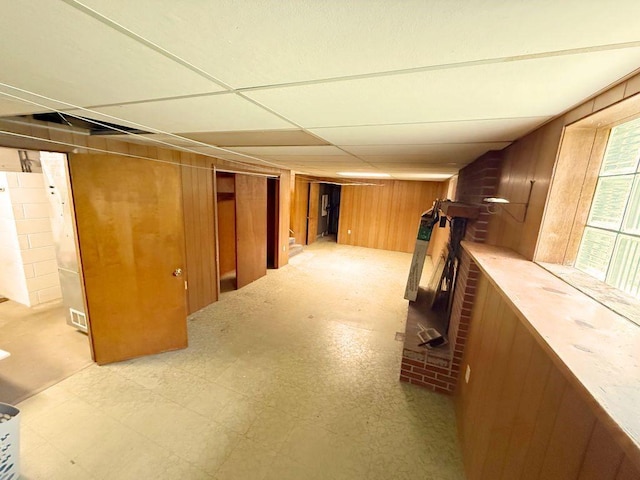 717 King St, Mckeesport, PA 15132 - basement featuring wooden walls, light floors, and a paneled ceiling
