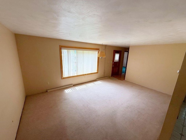 717 King St, Mckeesport, PA 15132 - unfurnished room with baseboard heating and light colored carpet