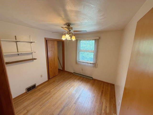 717 King St, Mckeesport, PA 15132 - unfurnished room featuring baseboard heating, light wood-type flooring, and ceiling fan