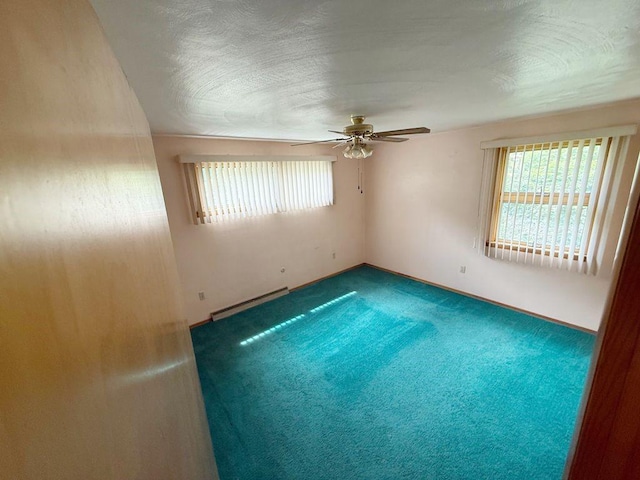 717 King St, Mckeesport, PA 15132 - carpeted spare room with healthy amount of natural light, baseboard heating, and ceiling fan