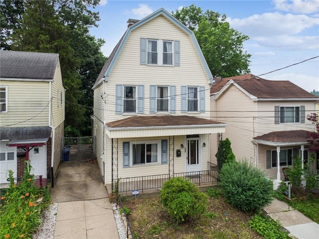 373 Copperfield Ave, Carrick, PA 15210 - colonial inspired home with a porch, a gambrel roof, and a balcony