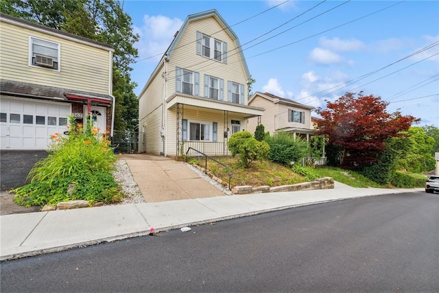 373 Copperfield Ave, Carrick, PA 15210 - view of front of home with driveway, a gambrel roof, and a porch