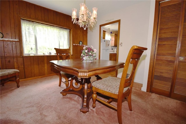 1673 Elderslee Rd, Baldwin Boro, PA 15227 - dining area with a chandelier, wood walls, and light colored carpet