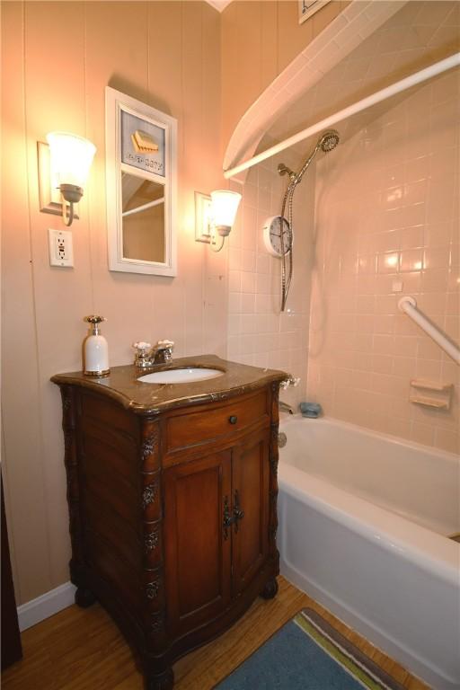 1673 Elderslee Rd, Baldwin Boro, PA 15227 - bathroom featuring vanity, bathtub / shower combination, and wood finished floors