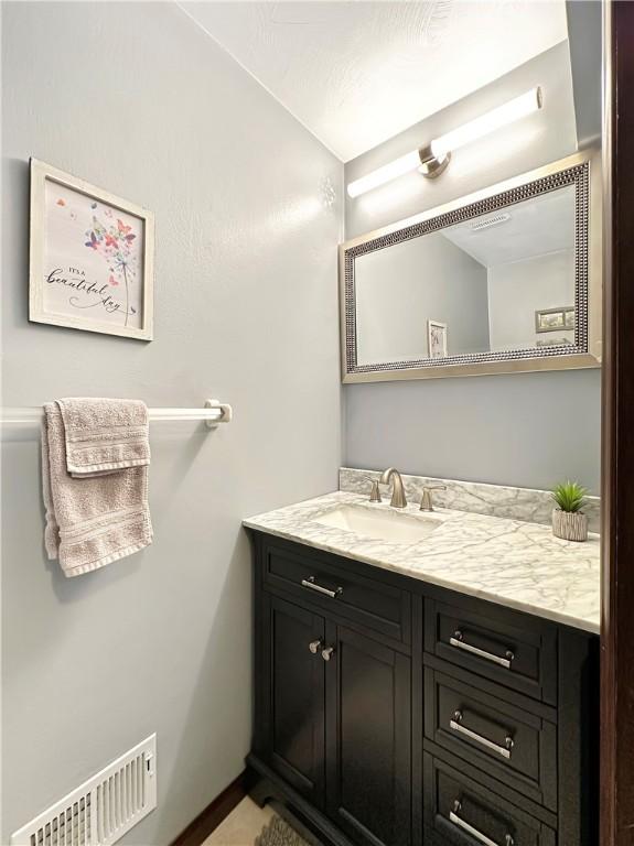 321 Jo Ann Dr, West Mifflin, PA 15122 - bathroom with vanity and baseboards