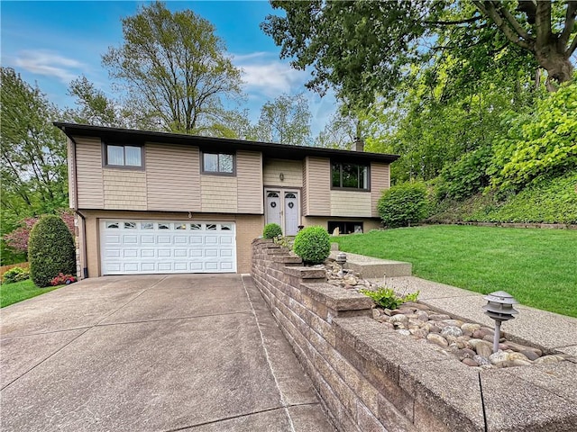321 Jo Ann Dr, West Mifflin, PA 15122 - bi-level home with an attached garage, driveway, and a front lawn