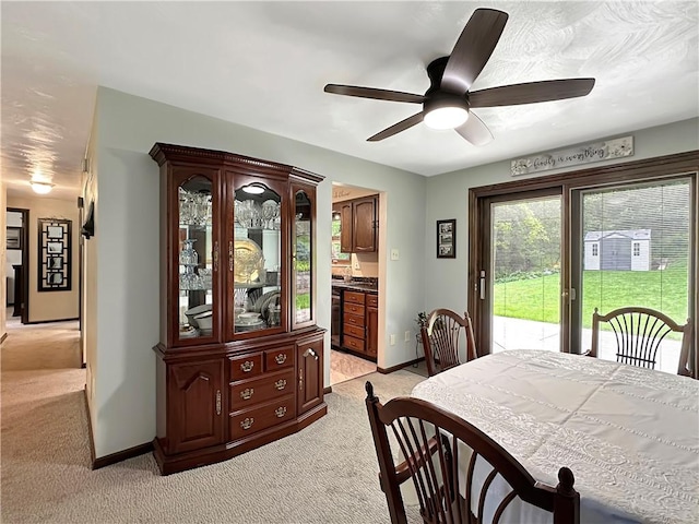 321 Jo Ann Dr, West Mifflin, PA 15122 - dining space with light colored carpet and a ceiling fan