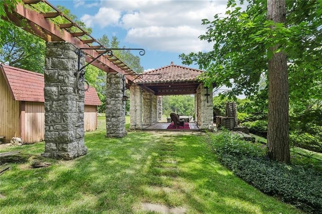 221 E Moody Ave, New Castle/2Nd, PA 16101 - view of green lawn featuring a pergola and a patio area