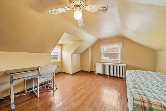 3176 Churchview Ave, Baldwin Boro, PA 15227 - bedroom featuring radiator heating unit, wood-type flooring, multiple windows, vaulted ceiling, and ceiling fan