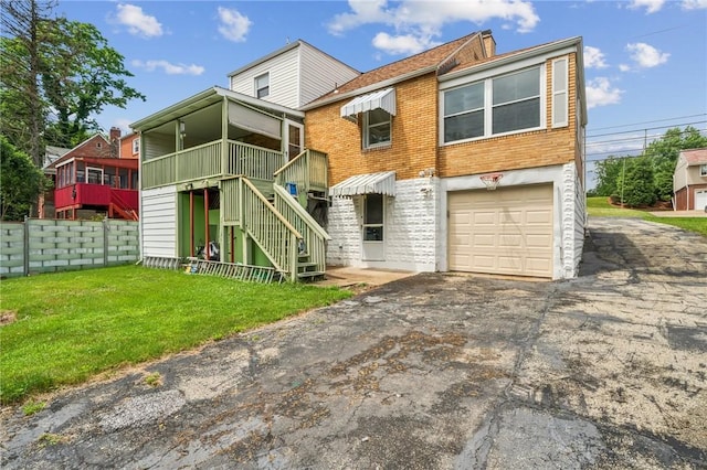3176 Churchview Ave, Baldwin Boro, PA 15227 - back of house featuring an attached garage, asphalt driveway, stairway, and brick siding