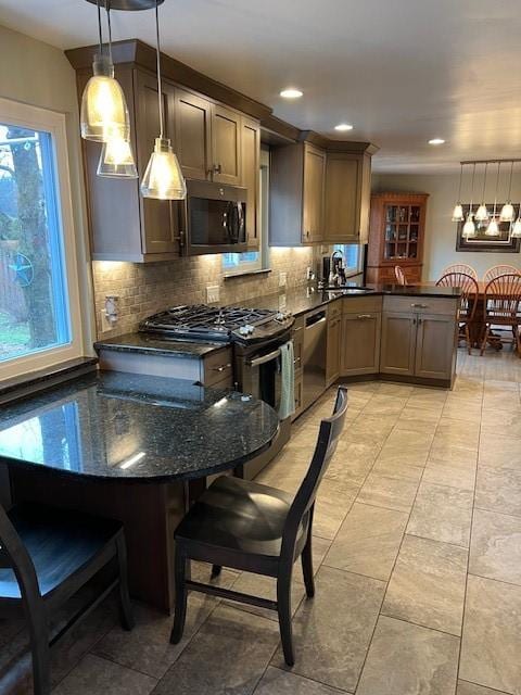 77 Ridgecrest Dr, Wilkins Twp, PA 15235 - kitchen featuring stainless steel appliances, a peninsula, tasteful backsplash, pendant lighting, and recessed lighting