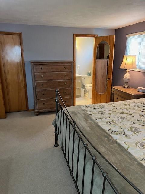 77 Ridgecrest Dr, Wilkins Twp, PA 15235 - bedroom with light carpet and ensuite bath