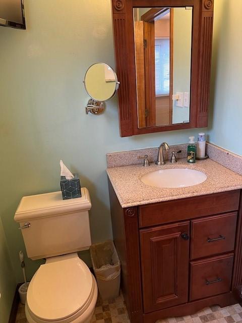 77 Ridgecrest Dr, Wilkins Twp, PA 15235 - half bathroom featuring vanity and toilet