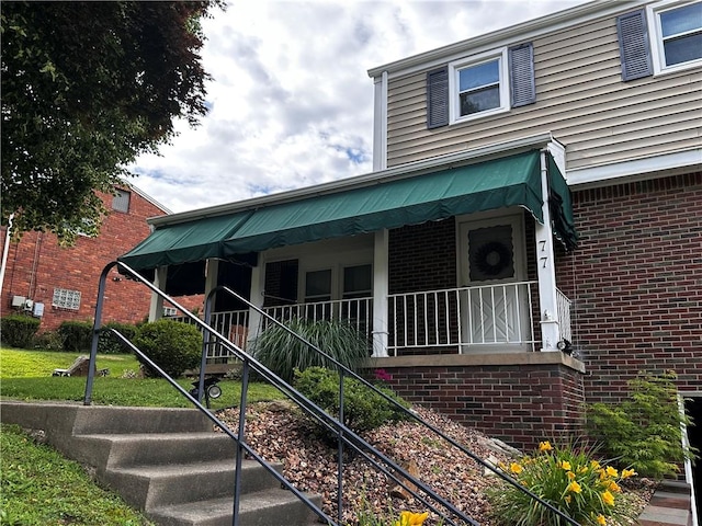 77 Ridgecrest Dr, Wilkins Twp, PA 15235 - view of front of property featuring brick siding and stairs