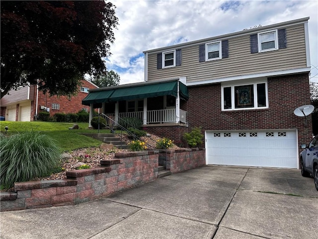 77 Ridgecrest Dr, Wilkins Twp, PA 15235 - view of front of home with a garage, concrete driveway, brick siding, covered porch, and a front yard