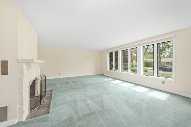 126 Elm Dr, Level Green, PA 15085 - unfurnished living room featuring carpet floors and a brick fireplace