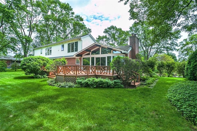 126 Elm Dr, Level Green, PA 15085 - back of property featuring a deck, a sunroom, a lawn, and a chimney