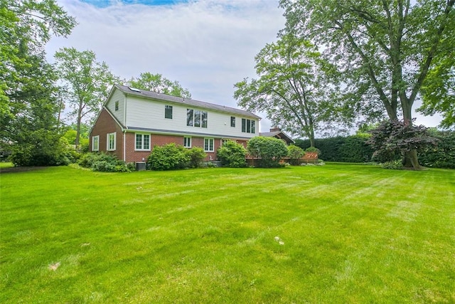 126 Elm Dr, Level Green, PA 15085 - rear view of property with a lawn and brick siding