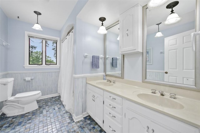 126 Elm Dr, Level Green, PA 15085 - bathroom with double vanity, a wainscoted wall, and a shower with curtain