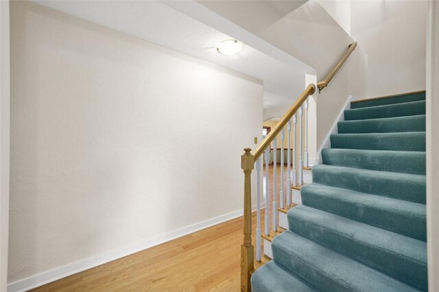 126 Elm Dr, Level Green, PA 15085 - stairs with wood finished floors and baseboards
