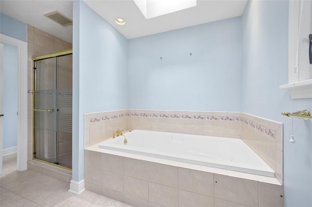 126 Elm Dr, Level Green, PA 15085 - full bathroom featuring a skylight, a garden tub, and a stall shower