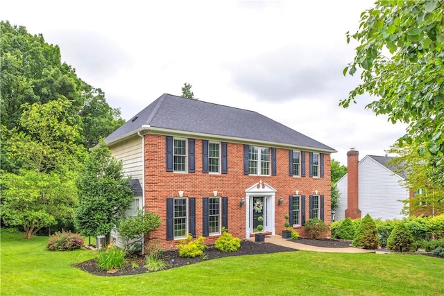 406 Pin Oak Ct, Coraopolis, PA 15108 - colonial home featuring a front lawn, brick siding, and roof with shingles