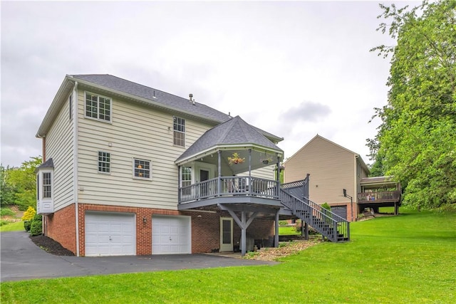 406 Pin Oak Ct, Coraopolis, PA 15108 - back of house with a wooden deck, a yard, an attached garage, and stairs