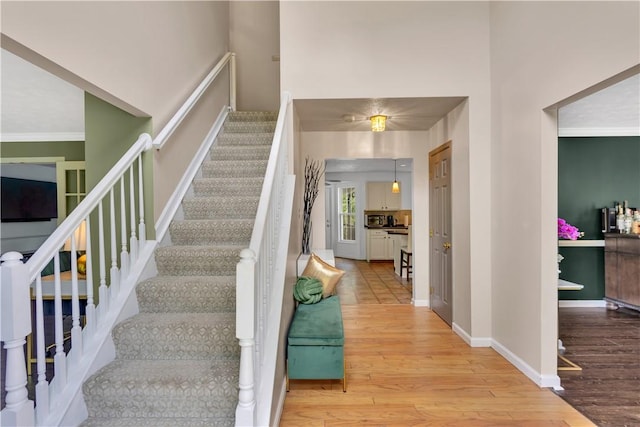 406 Pin Oak Ct, Coraopolis, PA 15108 - stairs featuring wood finished floors and crown molding