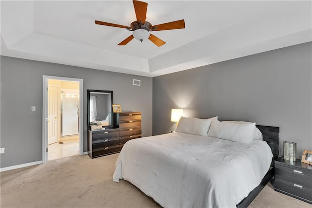 406 Pin Oak Ct, Coraopolis, PA 15108 - bedroom with a tray ceiling, light carpet, and a ceiling fan