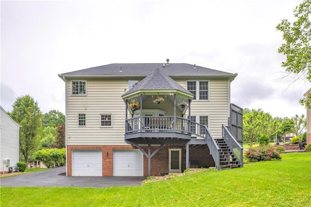 406 Pin Oak Ct, Coraopolis, PA 15108 - rear view of property featuring a lawn, stairway, an attached garage, asphalt driveway, and brick siding