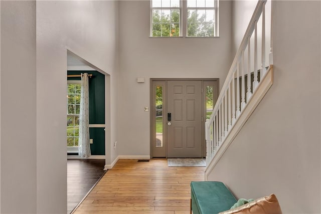 406 Pin Oak Ct, Coraopolis, PA 15108 - entryway with healthy amount of natural light, hardwood / wood-style flooring, stairs, and a high ceiling