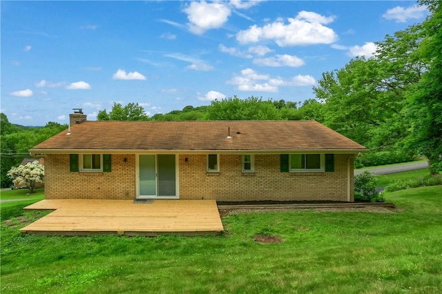 156 Dwellington Dr, Middlesex Twp, PA 16059 - back of house featuring a chimney, a yard, a wooden deck, and brick siding