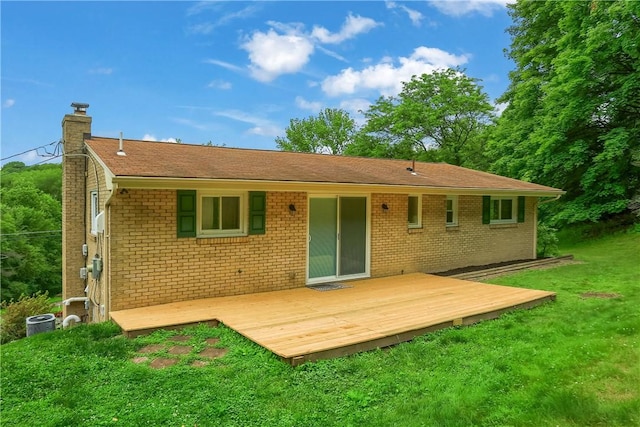 156 Dwellington Dr, Middlesex Twp, PA 16059 - back of property featuring a chimney, a lawn, a deck, and brick siding