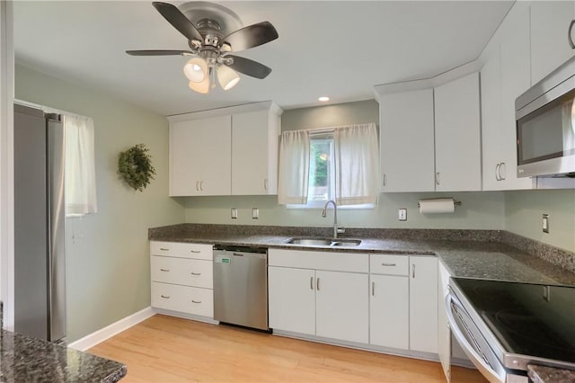 156 Dwellington Dr, Middlesex Twp, PA 16059 - kitchen featuring stainless steel appliances, light wood-style floors, white cabinets, a ceiling fan, and recessed lighting