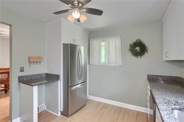 156 Dwellington Dr, Middlesex Twp, PA 16059 - kitchen featuring freestanding refrigerator, light wood-style flooring, white cabinetry, and a ceiling fan