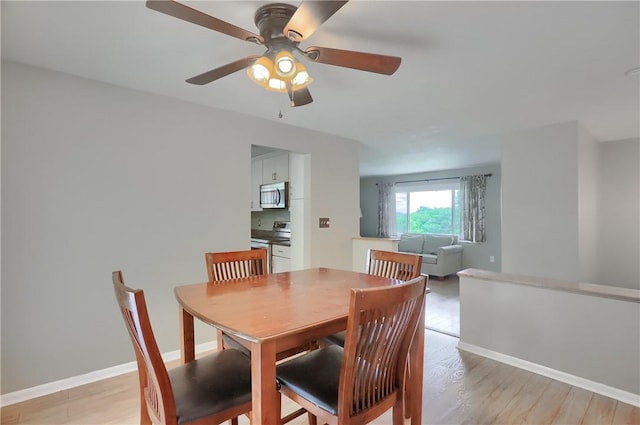 156 Dwellington Dr, Middlesex Twp, PA 16059 - dining area featuring a ceiling fan and light wood finished floors