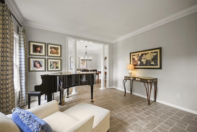 140 Golfview Dr, Adams Twp, PA 15044 - living area featuring decorative columns, stone finish floors, crown molding, healthy amount of natural light, and a chandelier
