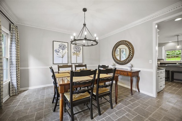 140 Golfview Dr, Adams Twp, PA 15044 - dining space featuring stone tile flooring, a chandelier, and crown molding