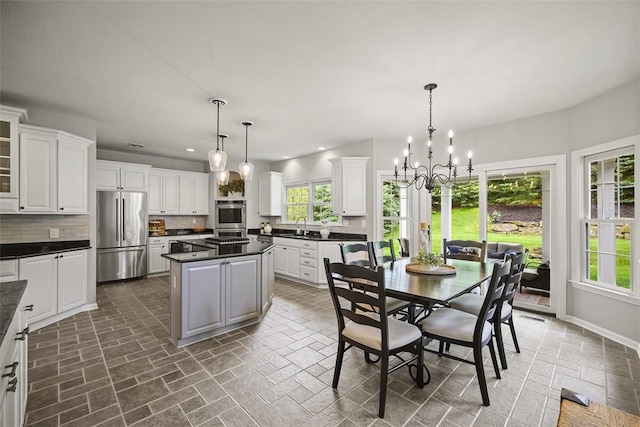 140 Golfview Dr, Adams Twp, PA 15044 - dining area featuring a chandelier and recessed lighting